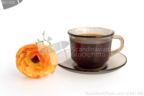 Image of A cup of coffee and orange flower