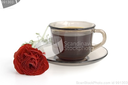 Image of A cup of coffee and red flower