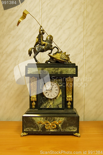 Image of Clock with a sculpture