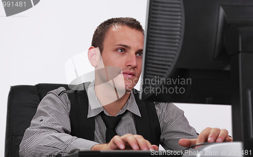 Image of Young man working on a computer