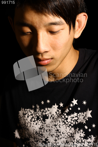 Image of Troubled - Portrait of young handsome asia man close eyes.