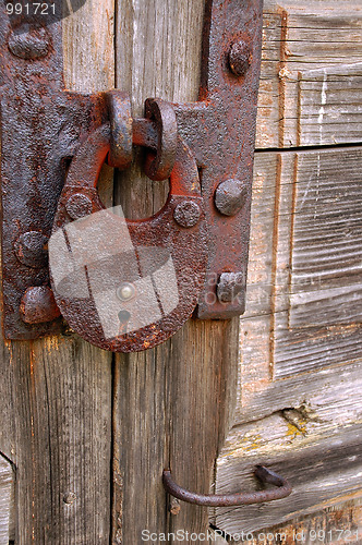 Image of Rusty Padlock on Shabby Gate