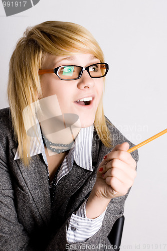 Image of businesswoman with pencil