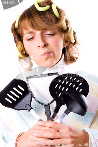 Image of housewife with kitchen utensil