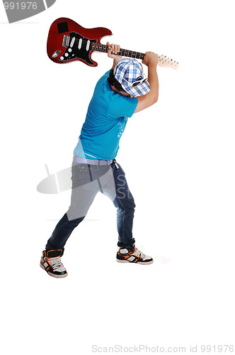 Image of Boy mad at the guitar.