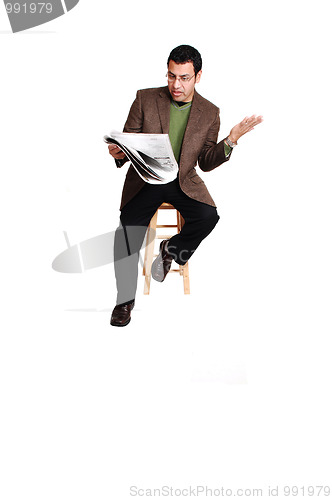 Image of Man reading newspaper.