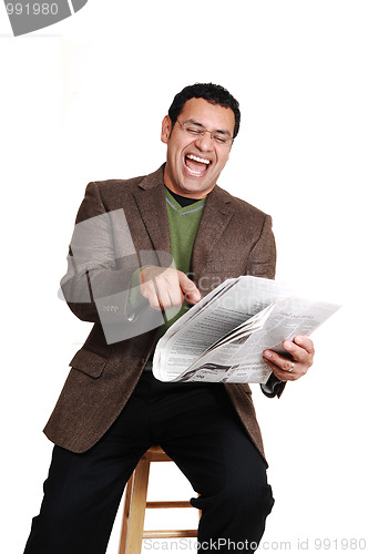 Image of Man reading newspaper.