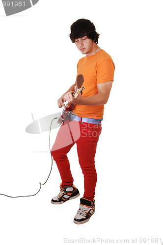 Image of Teen boy with guitar.