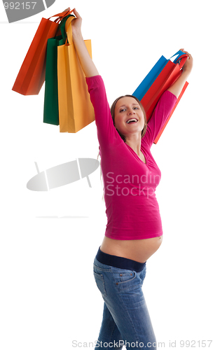 Image of Happy pregnant woman with shopping bags