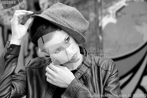 Image of  Woman playing with her hat