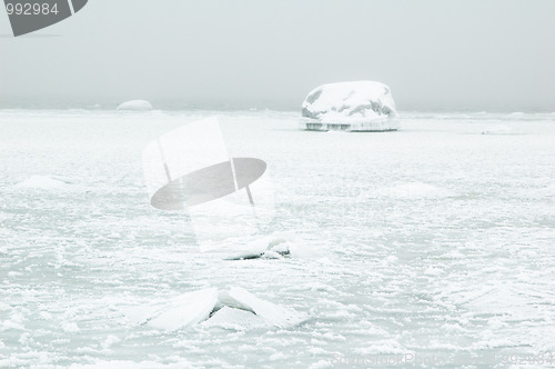 Image of Winter. The stones which have frozen and covered with ice on sea