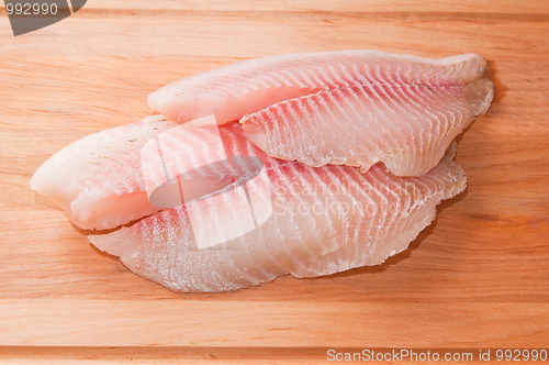 Image of Fillet of fish on a kitchen board 