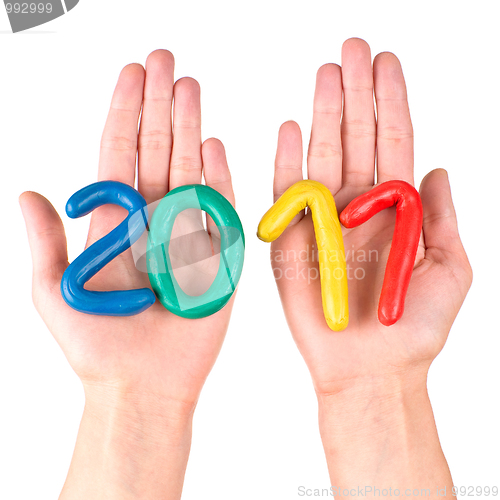 Image of Hands with plasticine figures