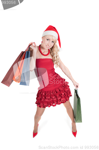 Image of Happy woman with Christmas presents