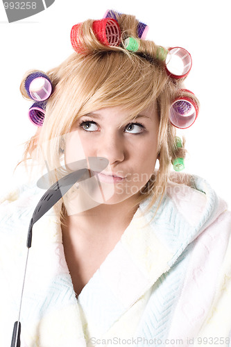 Image of funny housewife with curlers