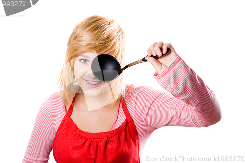 Image of young housewife with soup ladle