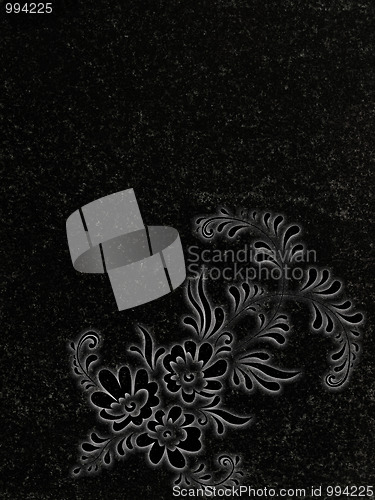 Image of decorated granite gravestone