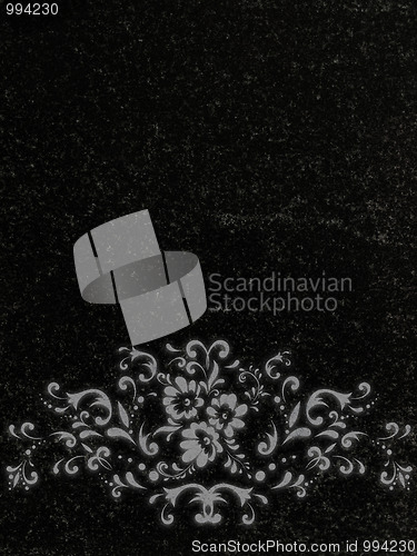 Image of decorated granite gravestone