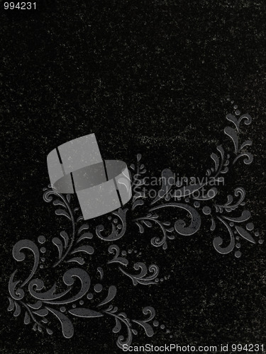 Image of decorated granite gravestone