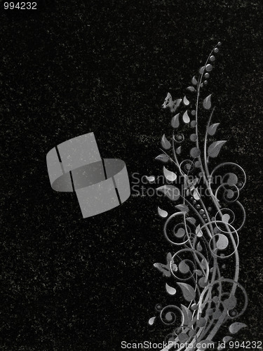 Image of decorated granite gravestone