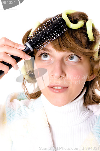 Image of woman with curlers and hearbrush