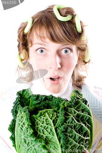 Image of woman and fresh savoy cabbage