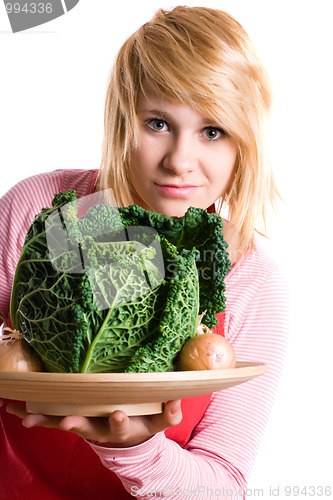 Image of woman with fresh savoy cabbage and onions