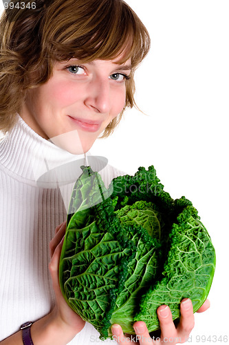 Image of woman with fresh savoy cabbage