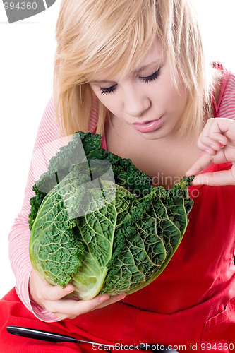 Image of woman with fresh savoy cabbage