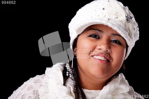 Image of Portrait of a young latin woman smiling, in autumn/winter clothes