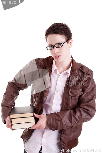 Image of young and beautiful boy, with books on the hands