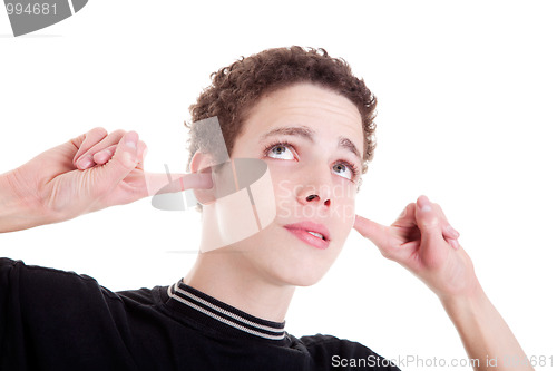 Image of Young man, holding fingers in his ears, bored, not listening