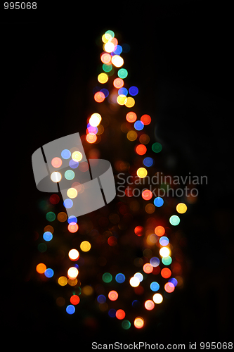 Image of christmas fir with defocused lightings