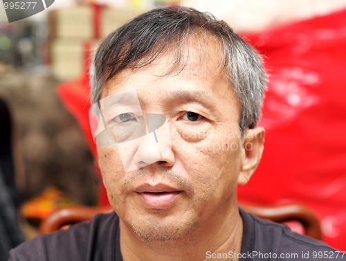 Image of middle age asian man