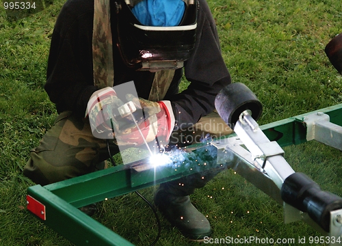 Image of Man welding