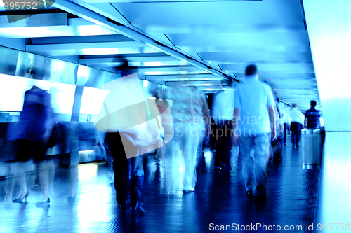 Image of busy people in blured motion