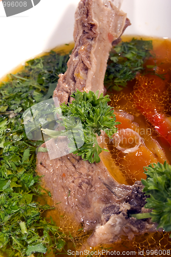 Image of appetizing hot soup in a soup-plate 