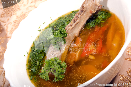 Image of appetizing hot soup in a soup-plate
