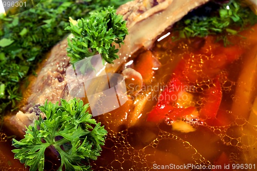 Image of appetizing hot soup in a soup-plate