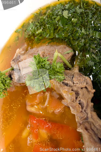 Image of appetizing hot soup in a soup-plate