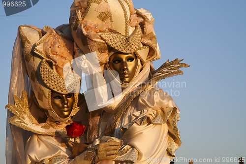 Image of A masked couple in love