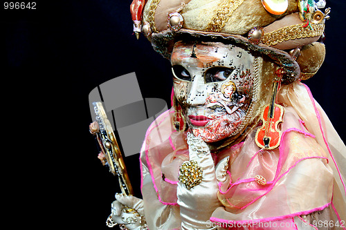 Image of Lady with a mask covered with musical notes