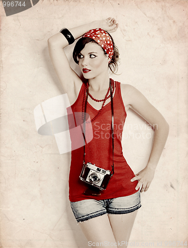 Image of Pin-up girl with a camera