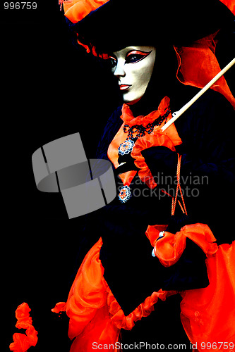 Image of A masked woman on black background