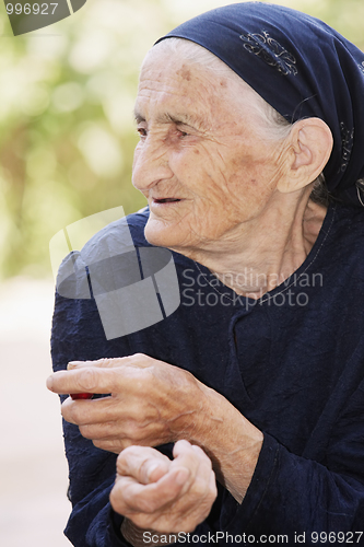 Image of Portrait of elderly woman looking sideways