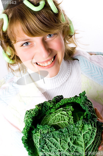 Image of beautiful woman with fresh savoy cabbage