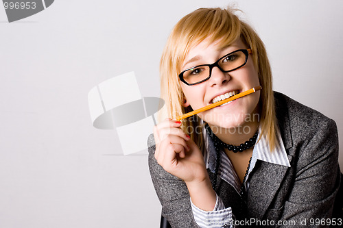 Image of  young businesswoman with pencil 