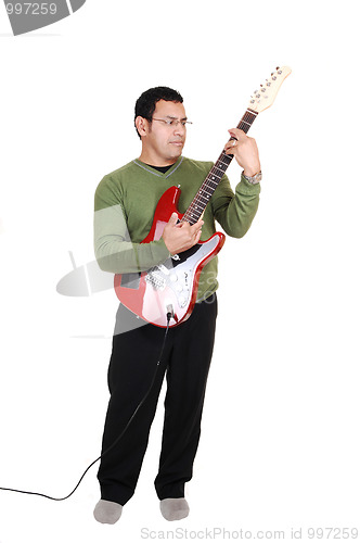 Image of Man standing with guitar.