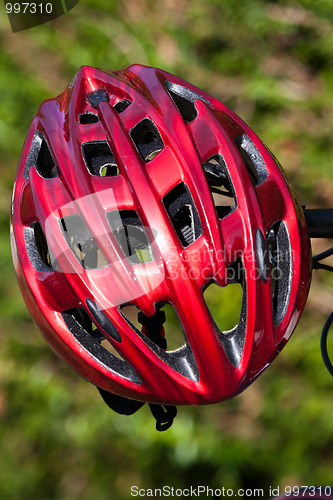 Image of red helmet lying on the grass