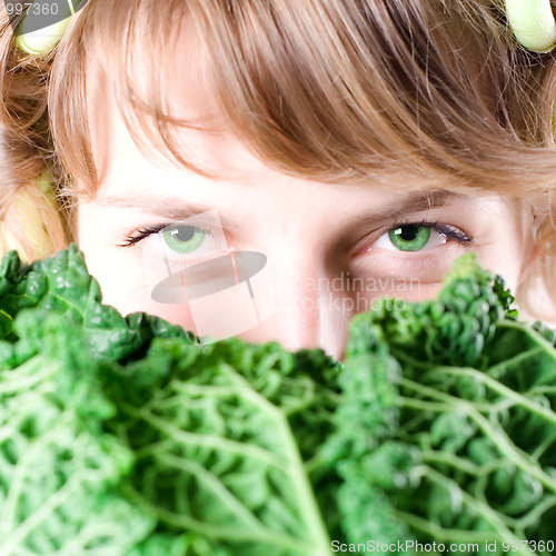 Image of woman with fresh savoy cabbage